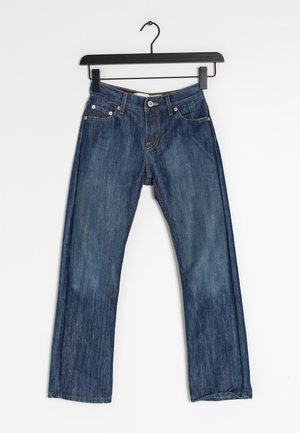 Siniset farkut suoran lahkeen leikkauksella, viiden taskun suunnittelulla ja yhdellä etunapilla. Kulunut ulkonäkö, jossa on kevyttä haalistumista.