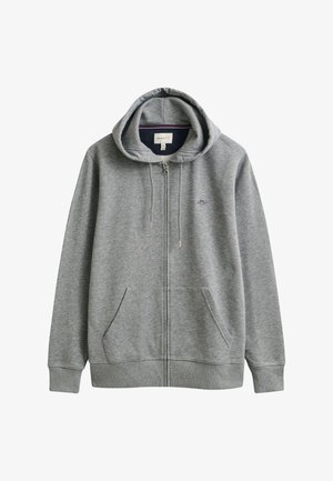 Hellgrauer Kapuzenpullover mit Reißverschluss vorne, Fronttaschen, Kordelzug an der Kapuze, gerippten Bündchen und kleinem gesticktem Logo auf der linken Brust.