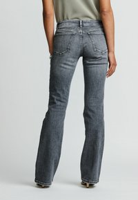 Next PETITE - Platėjantys džinsai - grey