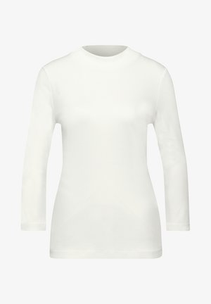 Biała, długa koszula z rękawami, o wysokim kołnierzyku i dopasowanym kroju, wykonana z gładkiego, lekkiego materiału bez widocznych wzorów lub akcentów.