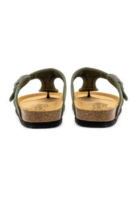 Zelene semiš sandale s plitvim podplatom iz plute, dvema nastavljivima trakama in črnim gumijastim podplatom, ki imajo minimalističen in ergonomski dizajn.