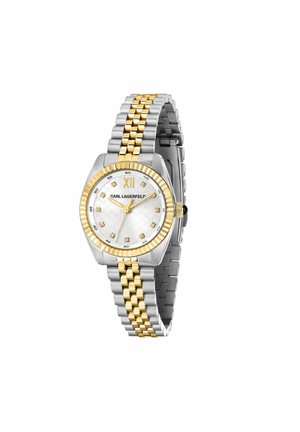 Tofarvet sølv- og guldkolors armbåndsur med hvid urskive, tolv timeindikatorer af krystaller, gyldigt romertal XII og Karl Lagerfeld-logo.