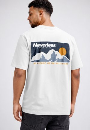 Man wearing white t-shirt with mountain graphic, orange sun, and text "Neverless Expedition" and "Go Outside and Feel Better Club" on back.