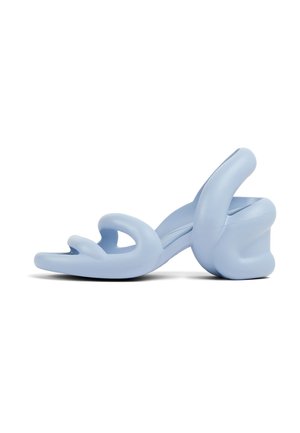 Light blue high-heeled sandals featuring a unique wavy design, made from smooth material with cut-out details and a chunky heel.