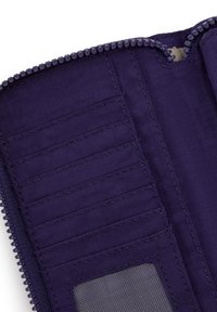 Purple fabric wallet with zipper, multiple card slots, and a mesh ID window, shown open on white background.