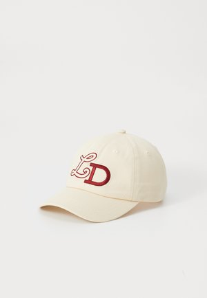 Beige cotton cap with a curved brim, featuring a red embroidered "LD" logo. The design includes vent holes and a top button.