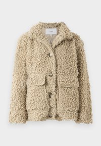 Giacca beige fuzzy realizzata in un tessuto a trama riccia, con colletto, bottoni frontali e due tasche a toppa.