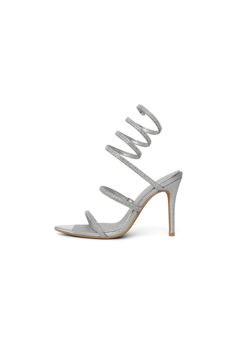 Glittery silver high-heeled sandal with spiral straps, open toe, and single metallic accent. Smooth surface and slender heels.