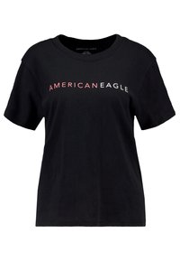 Svart bomull t-shirt med korta ärmar och rundad halsringning. Har "AMERICAN EAGLE" tryckt i vitt och rosa över bröstet.