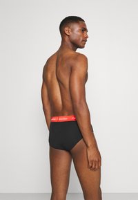 Calvin Klein Underwear HIP BRIEF 3 PACK COTTON STRETCH - Cuecas - black