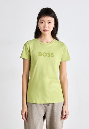 Short-sleeve, crew neck T-shirt in light green cotton, featuring a large "BOSS" print in a matching shade across the chest.