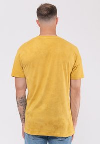Paradiso Clothing MUSE ORIGIN OF SYMMETRY DIP DYE MINERAL WASH - Print T-shirt - yellow