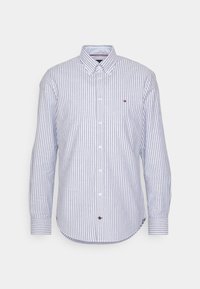 Camicia con bottoni, a righe verticali blu e bianche. Realizzata in cotone, presenta un colletto a punta, maniche lunghe e un dettaglio con logo vicino all'orlo.