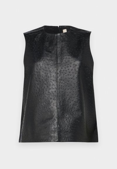 Black leather sleeveless top with a smooth finish and dotted texture. Features a round neckline and a central back zipper.
