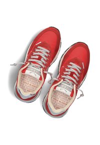 Red sneakers with a mixed material design featuring suede and mesh. Light gray laces and cushioned insoles with text pattern. Round toe and flat sole.