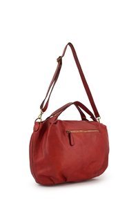 Red leather handbag with a smooth texture, dual top handles, and an adjustable shoulder strap. Features a dual zipper front pocket.