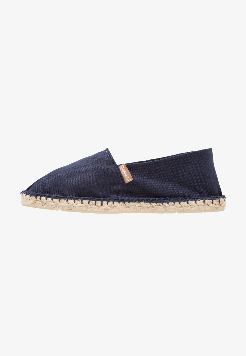 Navy blue espadrille with a canvas upper, a woven jute sole, and a contrasting tan label. Features a pointed toe and slip-on design.