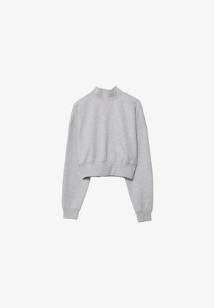 Světlé šedé zkrácené tričko s dlouhými rukávy, žebrovanými manžetami a lemem a vysokým kulatým výstřihem.