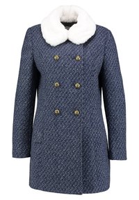 Dubbelt knäppt marinblå ullkappa med strukturerat mönster, sex guldknappar och stor krage i vitt konstp äls.