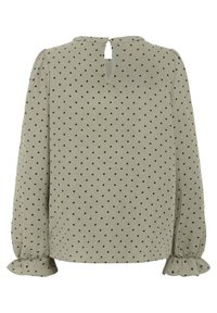 Långärmad blus i ljus olivgrön med svarta prickar. Har en nyckelhålsöppning på baksidan och volangärmar. Mjuk textur.
