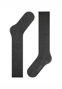 Šedé ponožky z měkkého, texturovaného materiálu. Mají hladký, zesílený špičku a žebrovaný lem, se zobrazeným logem značky poblíž kotníku.