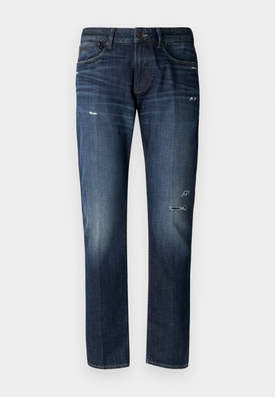 Tumši zili džinsi, brīvs piegriezums, ar nolietotiem akcentiem un smalku izbalēšanu. Klasiska piecu kabatu dizains ar pogas aizdari.