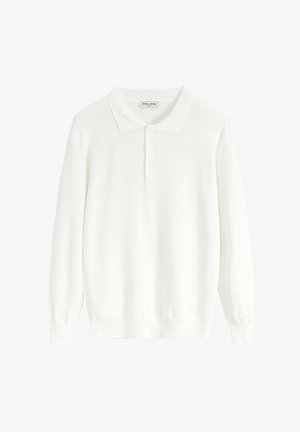 Polo shirt blanc à manches longues en tissu tricoté doux, doté d'un col classique, d'une patte de boutonnage à trois boutons et de poignets côtelés.