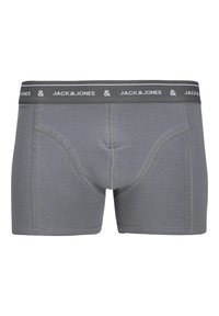 Sivé bavlnené boxerky s mäkkým pásom s nápisom "JACK & JONES" v bielej farbe, ploché švy a priliehavý strih.
