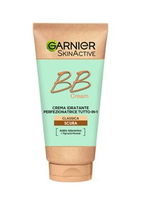 Tubo di Garnier BB Cream con corpo verde menta, tappo marrone e etichetta color crema. Contiene acido ialuronico e pigmenti minerali.