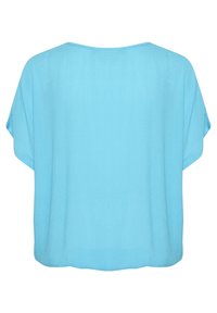 Chemisier bleu clair à manches courtes, coupe ample, avec un col rond, présenté à plat de dos sur un fond blanc.