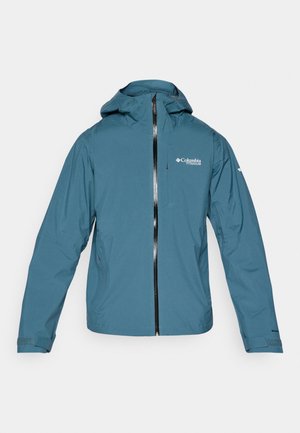 Veste bleu légère et imperméable avec capuche, fermeture éclair à l'avant et manches ajustables. Possède un logo sur la poitrine et des poches latérales.