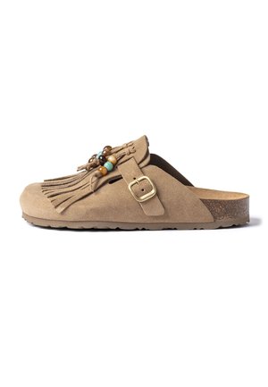 Light brown suede slip-on clog with fringe, decorative beads, adjustable buckle strap, and cork footbed sole.
