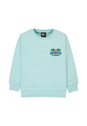 Sweat-shirt à manches longues bleu clair avec un logo Quiksilver représentant des palmiers, un coucher de soleil et des vagues océaniques sur le côté gauche de la poitrine.