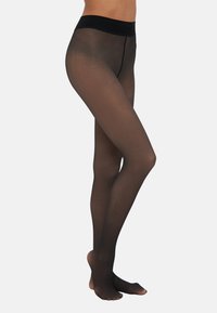 Meias pretas transparentes com uma textura suave, cintura, e acabamento translúcido, exibindo pernas numa pose lateral contra um fundo simples.