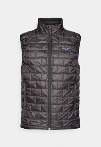 Black padded vest with a high collar, outlined stitching, front zip closure, and side pockets. Features Patagonia logo on the chest.