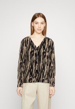 Blouse à manches longues avec un motif à rayures verticales beige et noir, design en V, fabriquée en tissu léger.