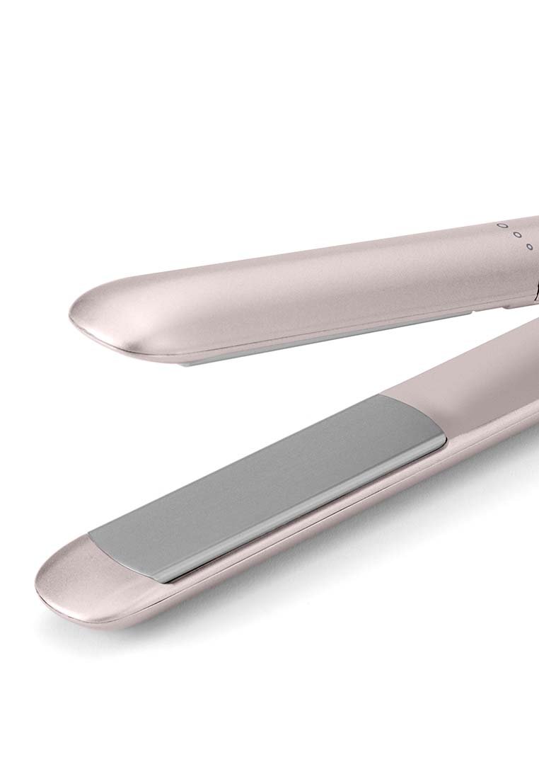 Haarglätter mit einem roségoldenen Finish, abgerundetem ergonomischem Design und silbernen Keramikplatten. Tasten am Griff zur Temperaturkontrolle.