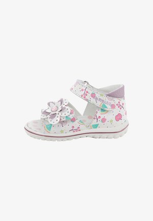 Sandalo bianco per bambino piccolo con stampa floreale e fruttata, dettagli rosa, cinturino in Velcro e fiore decorativo con gemma rosa sul davanti.