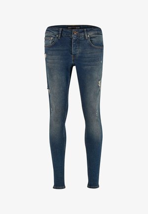 Kitse-sinised skinny teksad kulunud detailidega. Omavad viit taskut ja nööpidega sulgumist. Sile tekstuur ja istuv lõige.