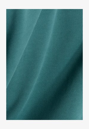 Teal cotton fabric with a ribbed texture, featuring vertical lines and smooth, soft surface. Shadows and highlights create depth.