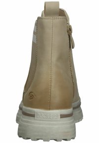 Beige leather ankle boots with a smooth finish, side elastic panels, rear pull tab, and textured white rubber sole.