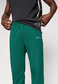 Champion ICONS CUFF PANTS - Jogginghose - dark green
