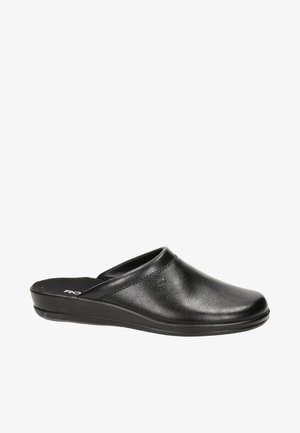 Zoccoli in pelle nera con punta arrotondata, tacco basso e design slip-on. Presentano una texture liscia e un delicato dettaglio di cucitura sulla parte superiore.