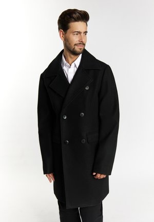 Black double-breasted overcoat with broad lapels, made of a textured fabric, featuring two large buttons and side pockets.
