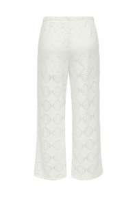 Pantaloni bianchi in pizzo con motivo a rombi, vita elasticizzata e gambe larghe e dritte. Tessuto lavorato a trama aperta.