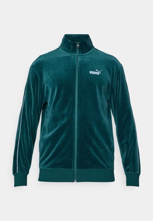 Tyrkysová sametová bunda na zip s vysokým límcem, dlouhými rukávy a bílými pruhy po stranách. Na hrudi se nachází malé bílé logo Puma.