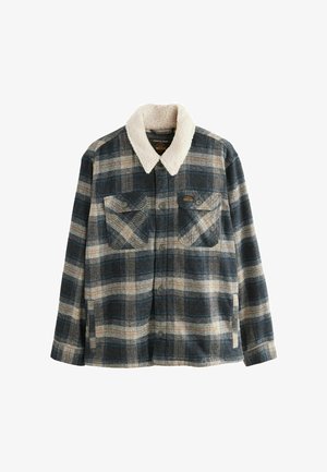 Flanelljacka med en mörkblå och beige rutmönster, en mjuk krämfärgad fårskinnskrage och två bröstfickor med knäppning.