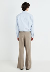 Weekday FLARED SUIT TROUSERS - Pantalon classique - dark mole