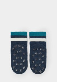 Navy-socken mit türkis- und weißen gestreiften Bündchen, mit strukturierten Gummi-Punkten an der Unterseite für besseren Halt, aus weichem Baumwollmaterial hergestellt.