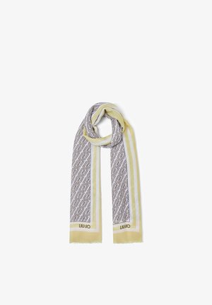 Világossárga és fehér sál összefonódó geometriai mintákkal és "Liu Jo" felirattal a rojtos végek közelében, hurkában összehajtva.